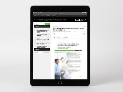 Strengths-Based Coaching Conversations With Teams Guide on a digital device.