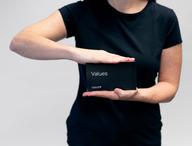 Person holding Values Card.