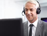 Person conducting a coaching conversation over the phone.